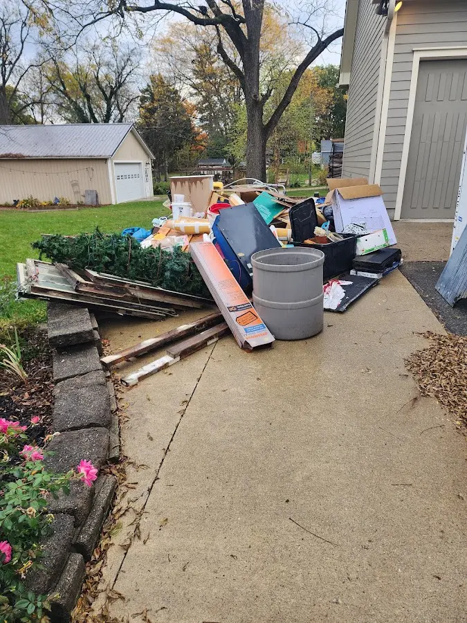 Dumpster being loaded with debris for Residential Dumpster Rental in Lakeland South